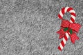 White and red candy cane with ribbon with gray plush