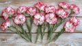 White And Red Carnations Arranged On Wooden Background Royalty Free Stock Photo