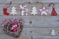 White red christmas decoration as christmas tree, reindeer and star on a old grey wooden planks background with empty copy space Royalty Free Stock Photo