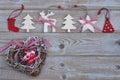 White red christmas decoration as christmas tree, reindeer and star on a old grey wooden planks background with empty copy space Royalty Free Stock Photo