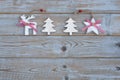 White red christmas decoration as christmas tree, reindeer and star on a old grey wooden planks background with empty copy space Royalty Free Stock Photo