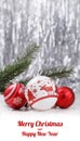 White and Red Christmas ornaments and fir tree branch on glitter bokeh background with space for text. Xmas and Happy New Year