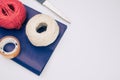 white and red decorative yarn balls on blue paper with stationery Royalty Free Stock Photo