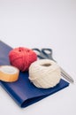 white and red decorative yarn balls on blue paper with stationery Royalty Free Stock Photo