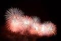 White and red fireworks display on dark sky background Royalty Free Stock Photo