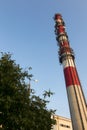 White-red industrial chimney with antennas Royalty Free Stock Photo