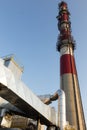 White-red industrial chimney with antennas Royalty Free Stock Photo