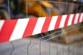 White and red marking tape marking a public construction site on Royalty Free Stock Photo