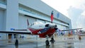 White and red plane on ground at Zhuhai International Aviation Expo and public Defense Exhibition