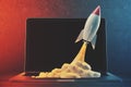 White and red rocket, laptop, space Royalty Free Stock Photo