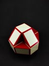 White and red rubik\'s toy isolated on a black - Stock photo