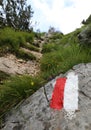 White and red sign in the mountain path Royalty Free Stock Photo