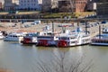 White and red steam boats docked on the banks in the Wolf Creek Harbor with a view of the skyscrapers and  office buildings Royalty Free Stock Photo