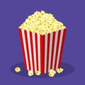 White and red striped paper popcorn bag isolated on background. Classic movie-theater full popcorn box. food cinema Royalty Free Stock Photo