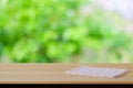 White and red tartan cloth on wood table over blur garden background Royalty Free Stock Photo