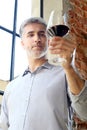 White or red wine? Man pours wine into a glass. Royalty Free Stock Photo