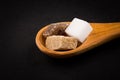 White refined and brown sugar in wooden spoon Royalty Free Stock Photo