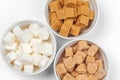 White refined sugar and brown unrefined sugar cubes