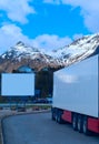 White refrigerated truck and big empty billboard
