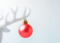 White reindeer antler with Christmas decoration on white background. Christmas or New Year minimal concept