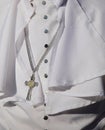 White religious cassock worn by the pontiff during ceremonies with the crucifix Royalty Free Stock Photo