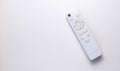 White remote control on a white background. Layout with copy space. Royalty Free Stock Photo