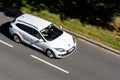 White Renault Megane Grandtour B95 estate car with motion blur effect