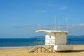 White rescue hut on a sandy beach, safe relax by the ocean, a be Royalty Free Stock Photo