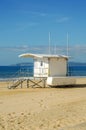 White rescue hut on a sandy beach, safe relax by the ocean, a be Royalty Free Stock Photo