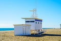 White rescue hut on a sandy beach, safe relax by the ocean, a be Royalty Free Stock Photo