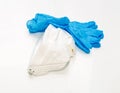 White respirators and blue nitrile medical gloves