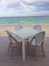 White restaurant bar table and chairs near the beach in Bahamas Royalty Free Stock Photo