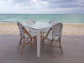 White restaurant bar table and chairs near the beach in Bahamas Royalty Free Stock Photo