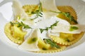 White Restaurant Plate of Ravioli 4 Cheeses with Cheese Espoume