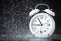 White retro alarm clock in a black background under the water drops.. Morning. Break. Motivation. Business solutions. Success. Royalty Free Stock Photo