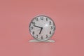 White retro alarm clock without external bell. isolated on pink background Royalty Free Stock Photo