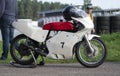 White retro motorccycle with red seat