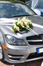 Bouquet on the hood of the wedding car Royalty Free Stock Photo