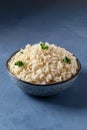 White rice in a bowl, boiled, served with parsley