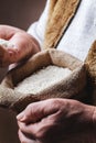 White rice in old hand Royalty Free Stock Photo