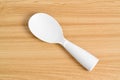 White rice spoon or rice ladle on wooden table Royalty Free Stock Photo