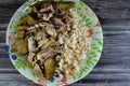 white rice with vermicelli cooked on hot steam, slices of potatoes, zucchini, onion and tomato with chicken chunks and pieces