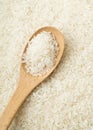 White rice on wooden teaspoon