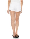 White ripped denim shorts for womenÃ¢â¬â¢s paired with silver heels and white background, Hot White Faded Destroyed Denim Mini Shorts