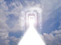 White road of light through a tunnel of doors among the clouds in the sky Royalty Free Stock Photo