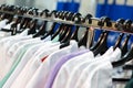 White robes on hangers. Clothes for medical workers in a specialized store