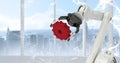White robot claw holding red cog against white interface and window with skyline