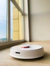 White robot cleaner. Robot vacuum cleaner on laminate floor in action Royalty Free Stock Photo