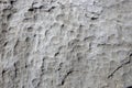 White rock rough texture. Stone surface photo. Chipped stone surface with cutter marks. Aged stone wall closeup Royalty Free Stock Photo