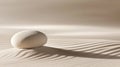 A white rock sits in the sand, casting a long shadow. Royalty Free Stock Photo